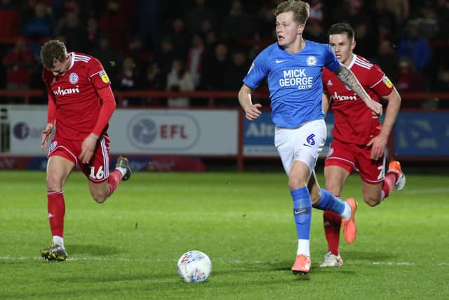 Frankie Kent of Peterborough United surges forward with the ball against Accrington Stanley. Photo: Joe Dent/theposh.com.