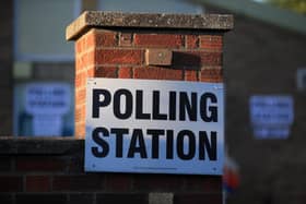 A sign is seen at The Christ the Carpenter church Hall polling station in Peterborough (image: Lindsey Parnaby/AFP via Getty Images)