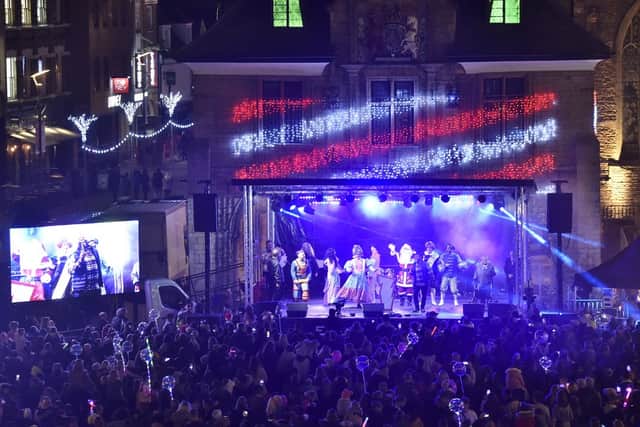 The New Theatre panto cast performed on stage while the crowd geared up for the festive lights.