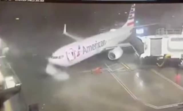 Plane blown away from airport gate by ferocious 80mph winds.