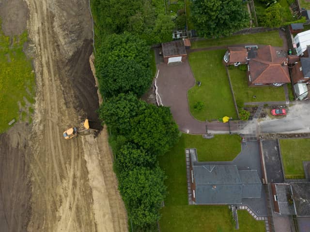 Cracks appear in driveways after start of nearby building work.