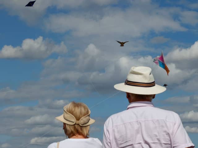 An elderly couple watches as members of the Afghan community and Londoners fly kites on Hampstead Heath. UK pensioners are set for a likely 4.8% state pension rise from April 2026 (Photo: CARLOS JASSO/AFP via Getty Images)