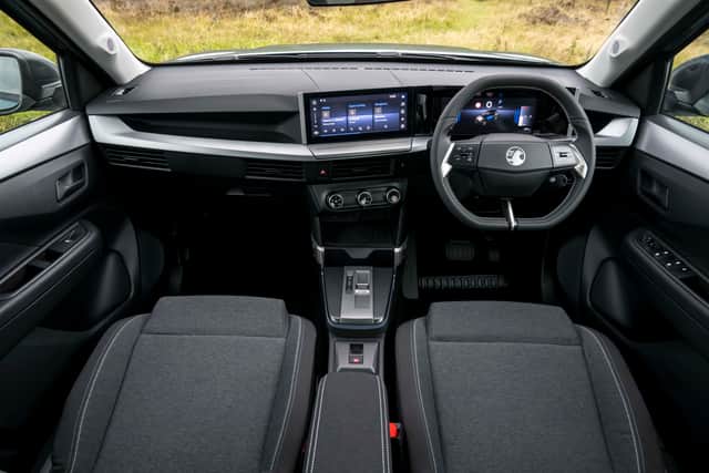 The cabin is minimalist but functional - with some very welcome physical controls added in