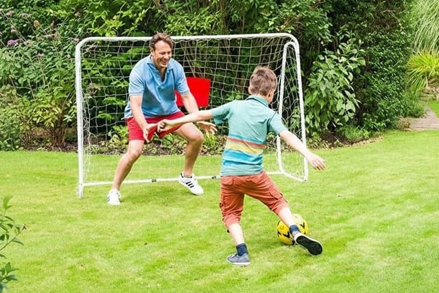 The foldable football goal includes a sturdy metal frame and provides plenty of space for family kickabouts and football practice in the garden.