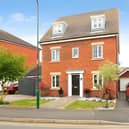This substantial detached home makes a strong first impression with family-friendly space extending well beyond the front door.