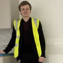 Sam Carling learning about house building