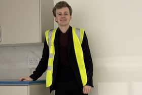Sam Carling learning about house building