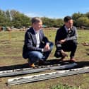 Andrew and Minister Stephen Morgan getting a demonstration from the Flag Fen Archaeology Team