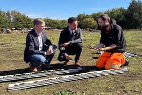 Andrew and Minister Stephen Morgan getting a demonstration from the Flag Fen Archaeology Team