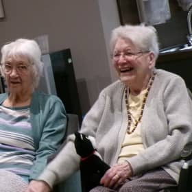 Residents enjoy the music performed by Steve Bull