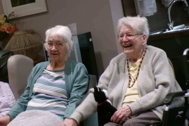 Residents enjoy the music performed by Steve Bull