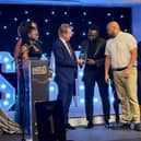 Mayor Paul Bristow handing out the voluntary award to Culture Community