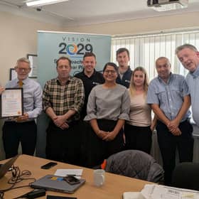 Ian (far left) receives his award certificate
