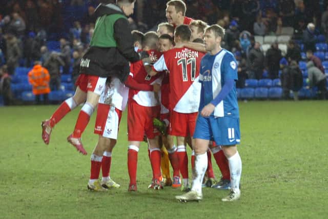 Kidderminster celebrate an FA Cup win at Posh.