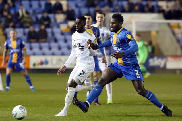 Mohamed Eisa of Peterborough United in action with Aaron Pierre of Shrewsbury Town. Photo: Joe Dent/theposh.com.