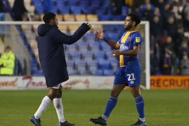 Posh defender Nathan Thompson of Peterborough United shakes hands with brother Louis Thompson of Shrewsbury after the game. Photo: Joe Dent/theposh.com.