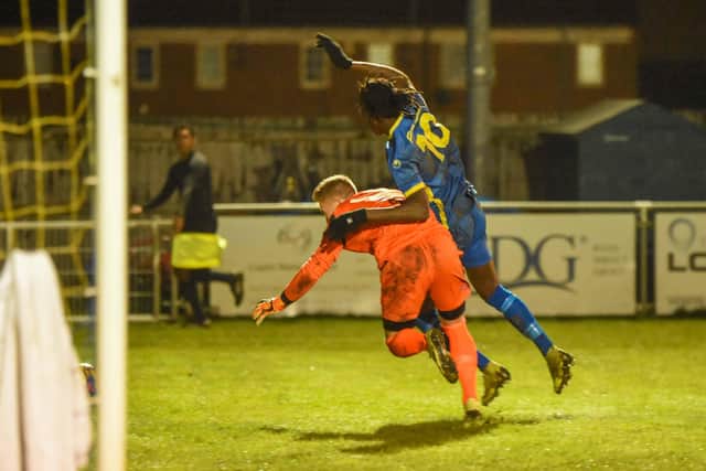 Peterborough Sports striker Maniche Sani is fouled by the Lowestoft goalkeeper to earn the city side a penalty. Photo: James Richardson.