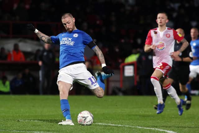 Marcus Maddison of Peterborough United shoots at goal against Stevenage. Photo: Joe Dent/theposh.com.