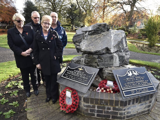 Remembrance Sunday in Peterborough City Centre. The family of WO2 Colin Beckett lay a wreath at his memorial in Bishop's Gardens. EMN-191011-212541009