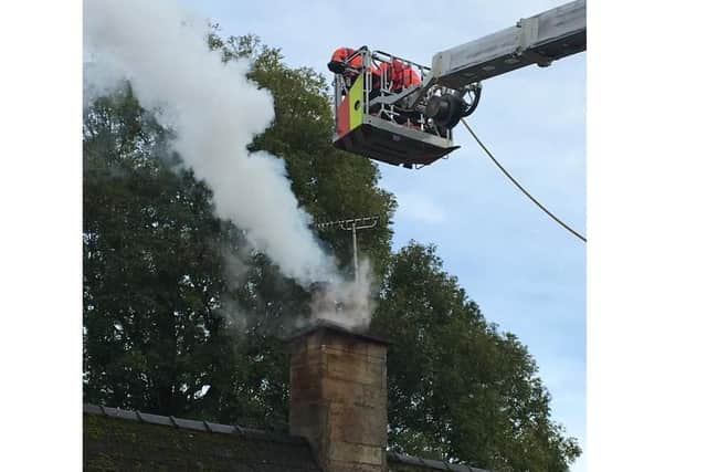 The chimney fire in Stibbington being tackled. Photo: Cambridgeshire Fire and Rescue Service