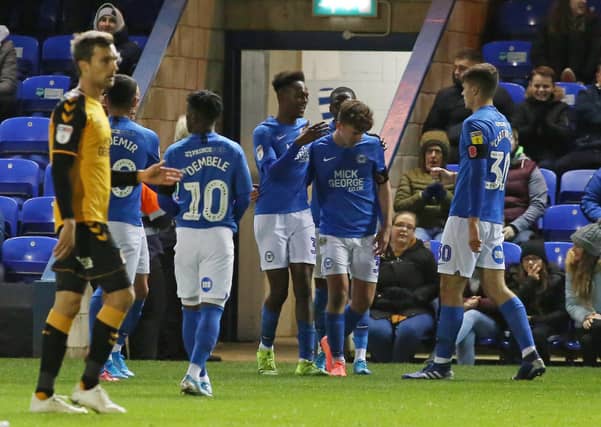 Posh players congratulate Rick-Jade Jones on his goal against Cambridge. Photo: Joe Dent/theposh.com.