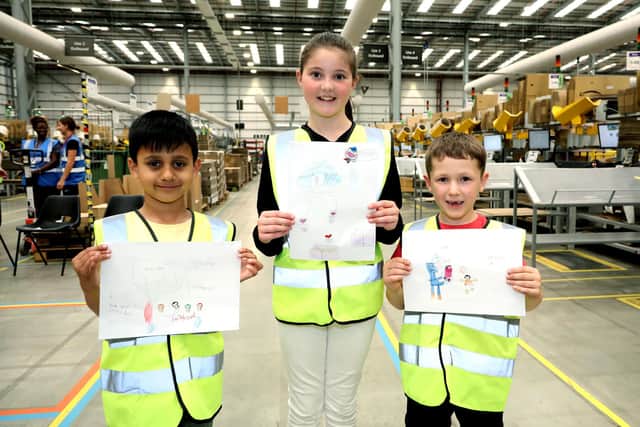 The Amazon EUK5: IET Open Day, at Peterborough, pictured (left to right): Krish Desai (6), Lyla Hendry (9), Daniel Marks (6) with their drawings PHOTO: Paul Marriott