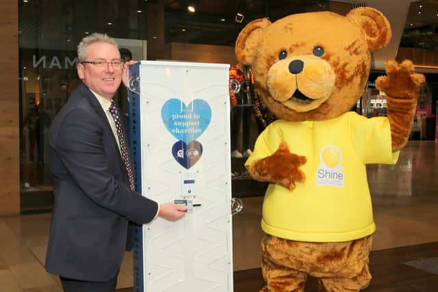 Queensgate centre director Mark Broadhead with the Shine mascot
