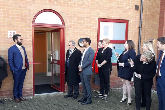 Mayor of Peterborough Gul Nawaz prepares to cut the ribbon to open the new Major Travel office.