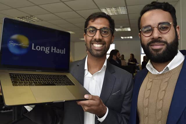 Qasim Gulamhusein (MD) and partner Mohammed Rashid at the launch of Major Travel at Lynch Wood, Peterborough.