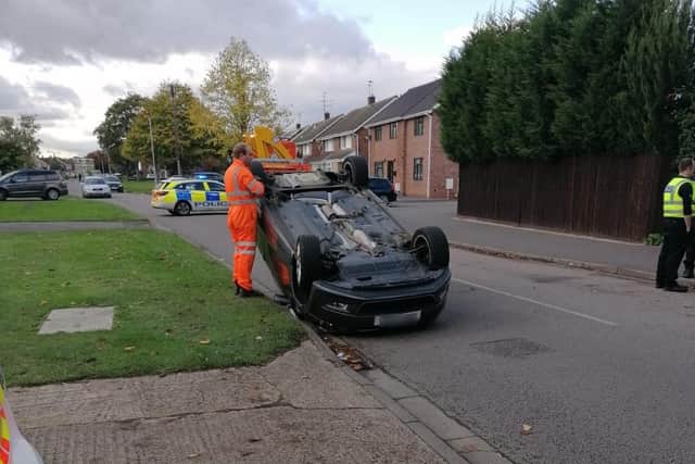 A car on its roof in Ledbury Road