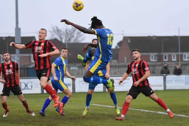 Maniche Sani of Peterborough Sports goes up for a header in the FA Trophy tie against Kettering. Photo: James Richardson.