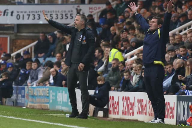 Peterborough United Manager Darren Ferguson alongside Burton Albion manager Nigel Clough. Photo: Joe Dent/theposhcom.