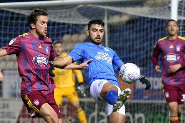 Serhat Tasdemir battles for the ball