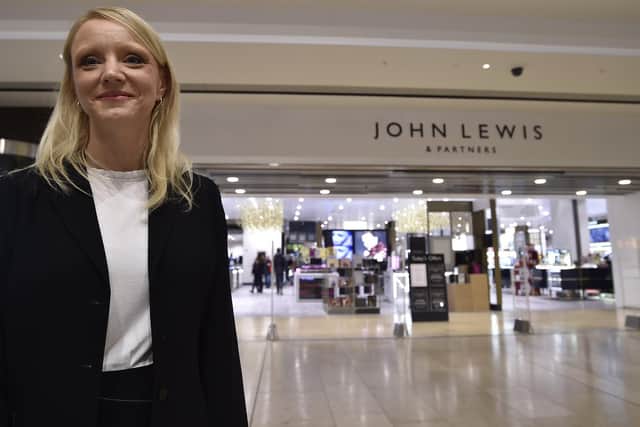 John Lewis and Partners' operations manager Tracy Venner outside the store with its new branding.