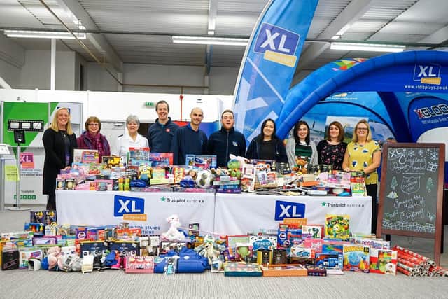 XL Displays' staff with gifts donated last Christmas.