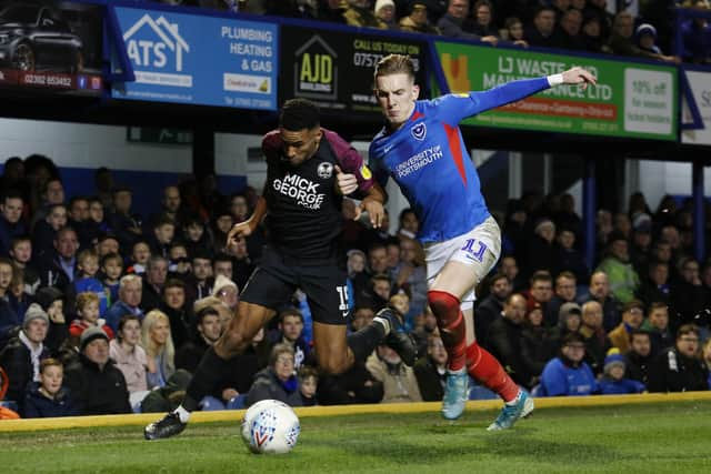 Nathan Thompson of Peterborough United battles with Ronan Curtis of Portsmouth. Photo: Joe Dent/theposh.com.