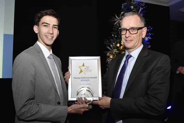 Peterborough Telegraph Pride in Peterborough Awards 2019.  Sponsor Roderick Watkins, vice chancellor of Anglia Ruskin University with Young Achiever of the Year winner Alex Brfaybrook EMN-191012-002918009