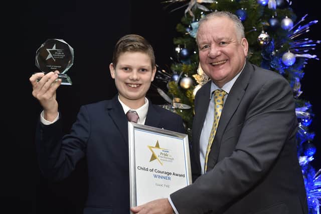 Peterborough Telegraph Pride in Peterborough Awards 2019.  Child of Courage award winner  Isaac Fell with Paul Richardson. EMN-191012-002945009