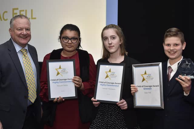 Peterborough Telegraph Pride in Peterborough Awards 2019.  Child of Courage award winner  Isaac Fell with Paul Richardson and runners-up Maryum Younis and  Hannah Thompson EMN-191012-002958009
