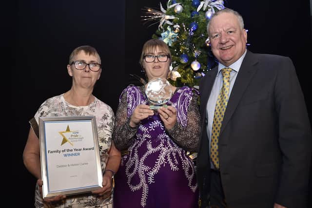 Peterborough Telegraph Pride in Peterborough Awards 2019. The Family of the Year award winners Debbie and Helen Clarke with Paul Richardson EMN-191012-002258009