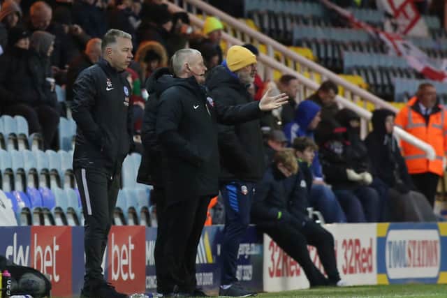 Peterborough United Manager Darren Ferguson looks on alongside Bolton Wanderers manager Keith Hill. Photo: Joe Dent/theposh.com.