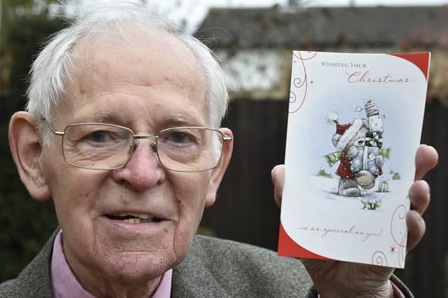 David Housden with one of the Christmas cards he has received EMN-191218-125220009