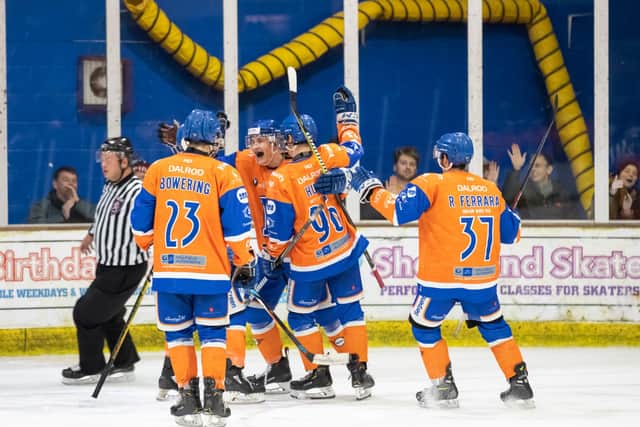 Martins Susters celebrates the second of his two goals against Bracknell with team-mates. Photo: Tom Scott.
