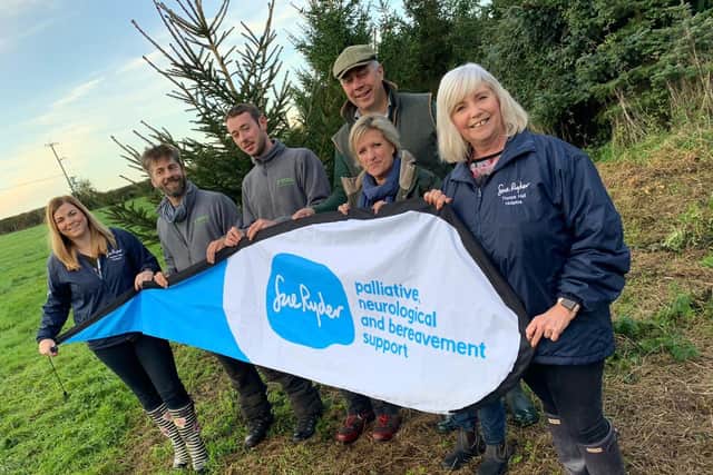 Staff from Sue Ryder Thorpe Hall Hospice and Nene Valley Tree Services