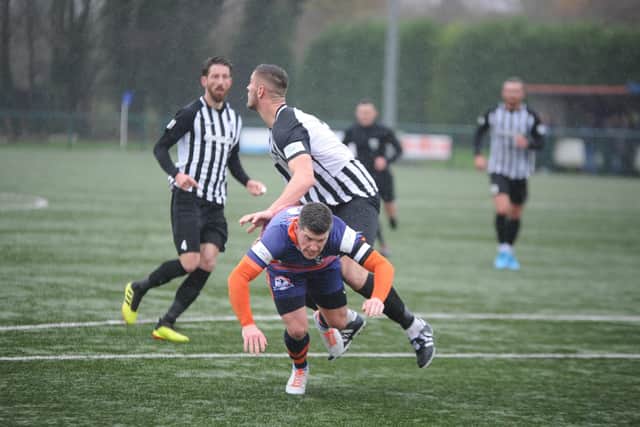 Action from Yaxley 0, Corby 3 (stripes) at the Decker Bus Stadium on Boxing Day. Photo: David Lowndes.