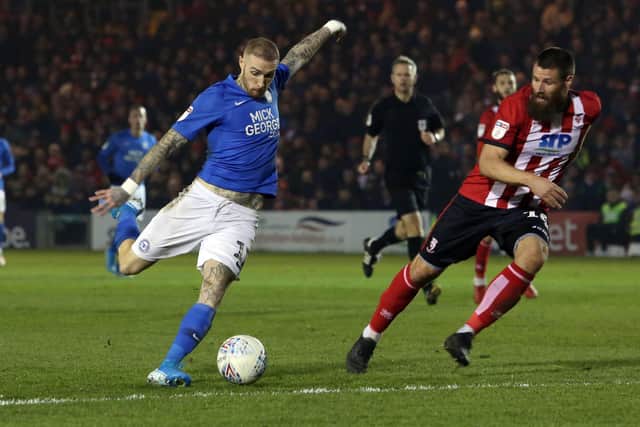 Posh star Marcus Maddison shoots against Lincoln. Photo: Joe Dent/theposhcom.