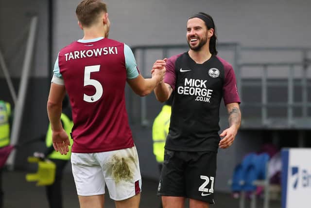 George Boyd of Peterborough United shakes hands with James Tarkowski of Burnley at full-time. Photo: Joe Dent/theposh.com.