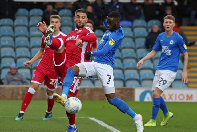 Mohamed Eisa of Peterborough United in action with Max Ehmer of Gillingham. Photo: Joe Dent/theposh.com.