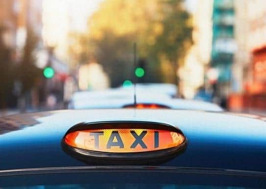 An investigation has been launched into a 'fake' taxi driver