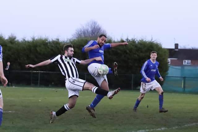 Fraser Sturgess (stripes) in action for Peterborough Northern Star against Rothwell. Photo: James Cox.